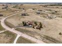 Expansive aerial view of a home on a large lot in a rural, but developed, community at 1505 Legacy Trl, Elizabeth, CO 80107