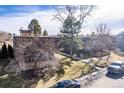 Complex of buildings from above, showing landscaping and parking spaces at 936 Eudora St # 102, Denver, CO 80220