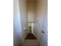 Hallway stairwell with carpet on the stairs leading to the lower level of the home at 1878 S Cole St, Lakewood, CO 80228