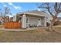 Charming home exterior featuring a welcoming porch, cozy seating, and well-maintained landscaping at 8755 Chase Dr # 167, Arvada, CO 80003