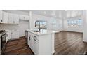 Modern kitchen featuring an island, stainless steel appliances, and an open layout at 3282 N Catawba Way, Aurora, CO 80019