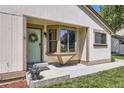Inviting front entrance featuring a light green door with wreath, complemented by a bay window at 7830 W 90Th Ave # 67, Broomfield, CO 80021