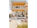 Charming front porch featuring concrete flooring and relaxing green adirondack chairs at 4330 N Raleigh St, Denver, CO 80212