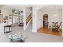 Bright, open-concept living area with soaring ceilings and large windows at 10795 Quail Creek E Dr, Parker, CO 80138