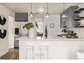Modern kitchen with sleek countertops, stainless steel appliances, and a stylish breakfast bar for casual dining at 6133 S Sterne Cir, Littleton, CO 80120