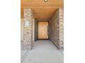 Close-up of the entrance, highlighting the modern wooden door, stone pillar, and contemporary design at 2190 Vine Ave, Boulder, CO 80304