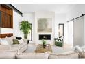 Cozy living room featuring a fireplace, comfortable seating, and abundant natural light at 2190 Vine Ave, Boulder, CO 80304