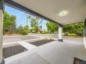Spacious front porch offers views of the street and neighborhood at 1694 Xanthia St, Denver, CO 80220
