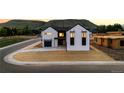 Modern two-story home with sleek exterior and dark garage doors at 5031 Moss Pl, Golden, CO 80403