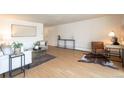 Well-lit living area featuring hardwood floors and modern decor, perfect for relaxation at 1090 N Lafayette St # 305, Denver, CO 80218