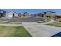 A quiet street featuring sidewalks lined with well-maintained homes and manicured lawns at 542 W 173Rd Ave, Broomfield, CO 80023