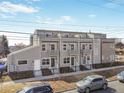 A row of lovely townhomes with wrought iron fencing are highlighted in this street view at 3480 W 14Th Ave, Denver, CO 80204