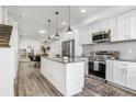Modern kitchen featuring white cabinetry, stainless steel appliances, and an island at 3480 W 14Th Ave, Denver, CO 80204