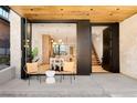 Inviting front porch with folding glass doors opening to dining area at 334 Steele St, Denver, CO 80206