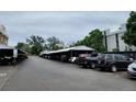 Outdoor parking lot with covered spots for residents of the apartment complex at 384 S Ironton St # 407, Aurora, CO 80012