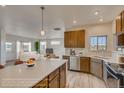 Well-designed kitchen with stainless steel appliances, a center island, and open access to the living area at 862 W 129Th Pl, Westminster, CO 80234