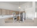 Bright kitchen with stainless steel appliances and ample counter space, perfect for cooking and entertaining guests at 5335 S Lisbon Way, Centennial, CO 80015
