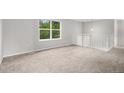 Open, carpeted loft area with white railings, perfect for a home office or additional living space at 3246 S Nucla St, Aurora, CO 80013