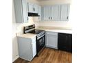 Kitchen featuring black appliances, light blue cabinets, and light countertops at 5151 Jasper St, Denver, CO 80239