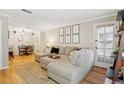 Bright living room with large sectional sofa, area rug, and decor at 2355 E Geddes Ave # C24, Littleton, CO 80122