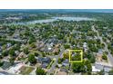 Stunning aerial view of property with mature trees and close proximity to a beautiful lake at 2217 King St, Denver, CO 80211