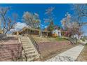 Street view showcasing the home's front exterior, landscaping, and neighborhood setting at 2217 King St, Denver, CO 80211