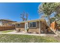 Quaint brick home with a well-kept yard and charming architectural details at 2217 King St, Denver, CO 80211