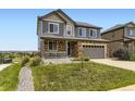 Beautiful two-story house with a well-kept lawn and appealing curb appeal at 7360 S Old Hammer Way, Aurora, CO 80016