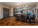 Open concept dining room with dark wood floors and modern kitchen at 975 N Lincoln St # 15A, Denver, CO 80203