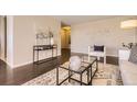 Cozy living room with stylish decor, a glass coffee table, and an accent rug at 955 Eudora St # 407E, Denver, CO 80220
