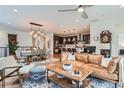 Bright living space with modern furnishings, dining area, and adjacent kitchen at 11253 Moondance Trl, Littleton, CO 80125