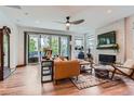 Cozy living room featuring modern furnishings, fireplace, and sliding doors at 11253 Moondance Trl, Littleton, CO 80125