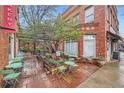Charming bakery rear entrance with outdoor seating and lush greenery at 753 Pearl St, Boulder, CO 80302