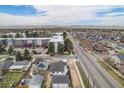 Overhead view of the property, highlighting its location in a residential area near mountains at 1990 Ulster St, Denver, CO 80220
