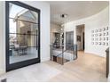 Inviting foyer with modern chandelier, hardwood floors, and staircase at 40 Royal Ann Dr, Greenwood Village, CO 80111