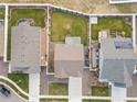 Aerial view of home showing the well-maintained backyard, neighboring properties, and surrounding landscaping at 1527 Biffle Ct, Berthoud, CO 80513