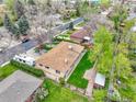 Overhead view of a home with a spacious backyard, mature trees, and a charming neighborhood setting at 460 S Taft St, Lakewood, CO 80228