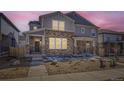 Charming two-story home featuring a stone facade, covered porch, and well-maintained landscaping in a vibrant community at 745 N Tempe St, Aurora, CO 80018