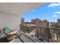 Balcony features outdoor seating and views of the surrounding buildings and neighborhood at 2 Adams St # 806, Denver, CO 80206