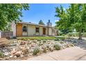 Beautiful single-Gathering house with a manicured front yard and unique rock garden feature at 4064 S Olathe Ct, Aurora, CO 80013