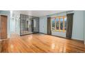 A well lit living room with hardwood floors and a bay window at 9590 Lowell Blvd, Westminster, CO 80031