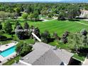 Aerial view of condo with community green space and swimming pool at 10150 E Virginia Ave # 13-204, Denver, CO 80247