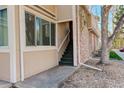Street level entrance showcasing the unit number, well-maintained stairs, and tasteful exterior finishes at 4931 Garrison St # 204G, Wheat Ridge, CO 80033
