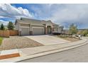 Charming single-Gathering home with a three-car garage and well-kept landscaping at 1034 Halfmoon Dr, Castle Rock, CO 80104