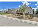 This charming single-Gathering home features well-maintained landscaping and an attached three-car garage at 1034 Halfmoon Dr, Castle Rock, CO 80104