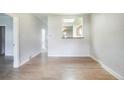 Bright living room with hardwood floors and a pass-through to the kitchen, offering an open and airy feel at 22 E Bayaud Ave, Denver, CO 80209