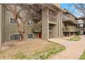 Exterior of the condo featuring stairs, balconies, and mature trees at 695 Manhattan Dr # 5, Boulder, CO 80303
