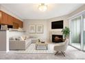Bright living room featuring a fireplace, sliding glass doors, and neutral decor at 695 Manhattan Dr # 5, Boulder, CO 80303