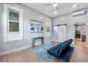 Bright living room with stylish decor, light wood floors, and plenty of natural light at 2737 N Marion St, Denver, CO 80205