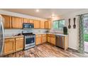 Charming kitchen equipped with modern stainless steel appliances and wood cabinets at 1842 Reliance Cir, Superior, CO 80027